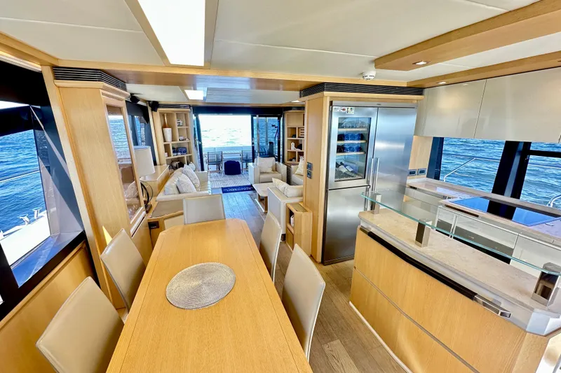 Slide: The Image of Luxurious interior of 2016 Absolute 72 FLY yacht with modern kitchen and dining area. - 86