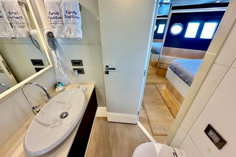 Slide: The Image of Luxurious bathroom and bedroom on a 2016 Absolute 72 FLY yacht, featuring modern amenities. - 95