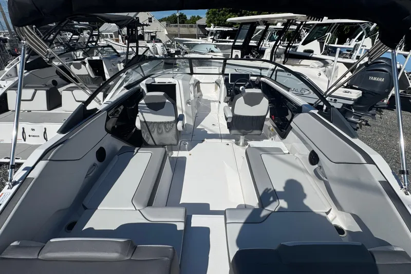 Slide: The Image of 2025 Yamaha Boats SX250 interior with seating, steering, and modern design features. - 3