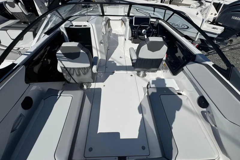 Slide: The Image of 2025 Yamaha Boats SX250 interior with modern seating and sleek dashboard design. - 4