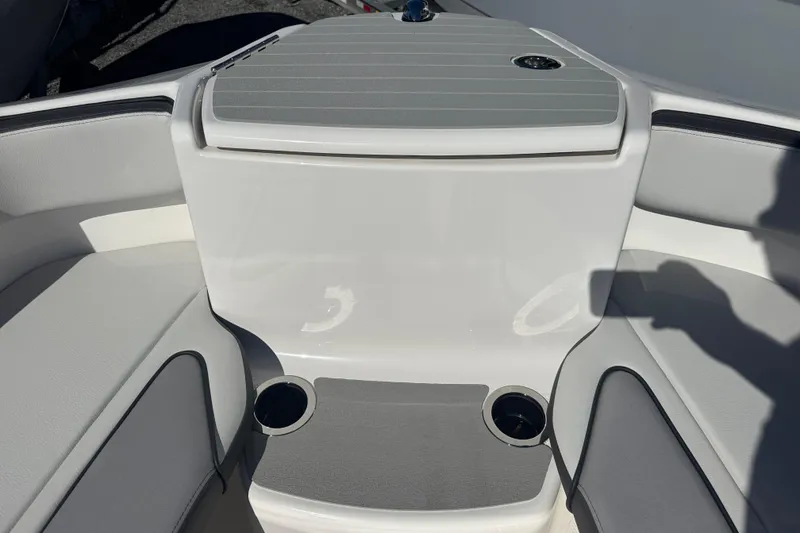 Slide: The Image of 2025 Yamaha Boats SX250 interior with seating and cup holders. - 6