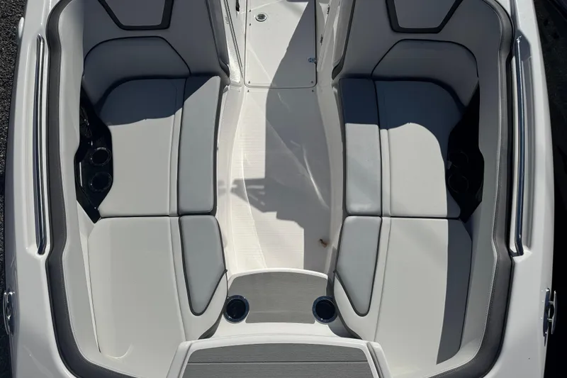 Slide: The Image of 2025 Yamaha Boats SX250 interior seating, featuring sleek gray and white upholstery. - 7