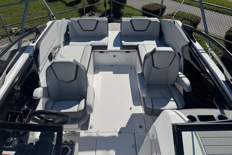 Slide: The Image of 2025 Yamaha Boats SX250 interior with modern seating and sleek design. - 8