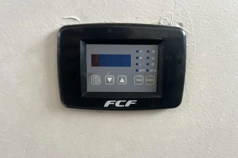 Slide: The Image of Digital control panel on a 1983 Custom Key West 39' Sportfish boat. - 15