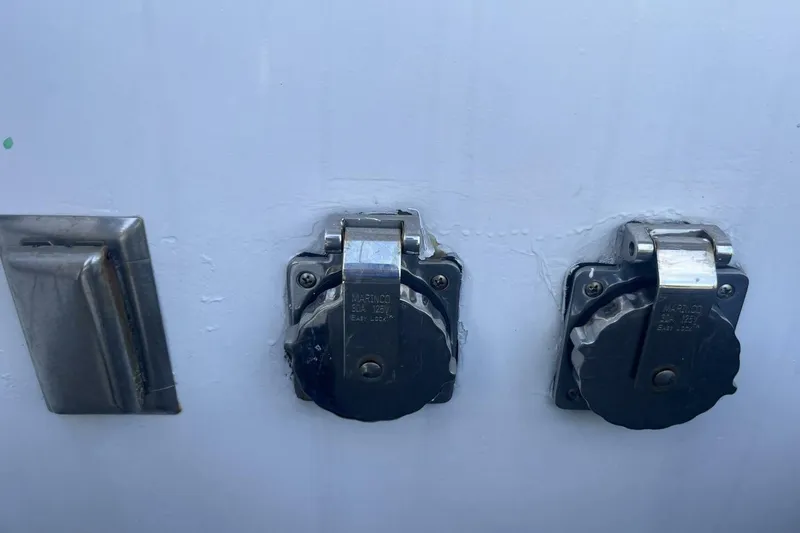 Slide: The Image of Close-up of electrical outlets on a 1983 Custom Key West 39' Sportfish boat. - 23