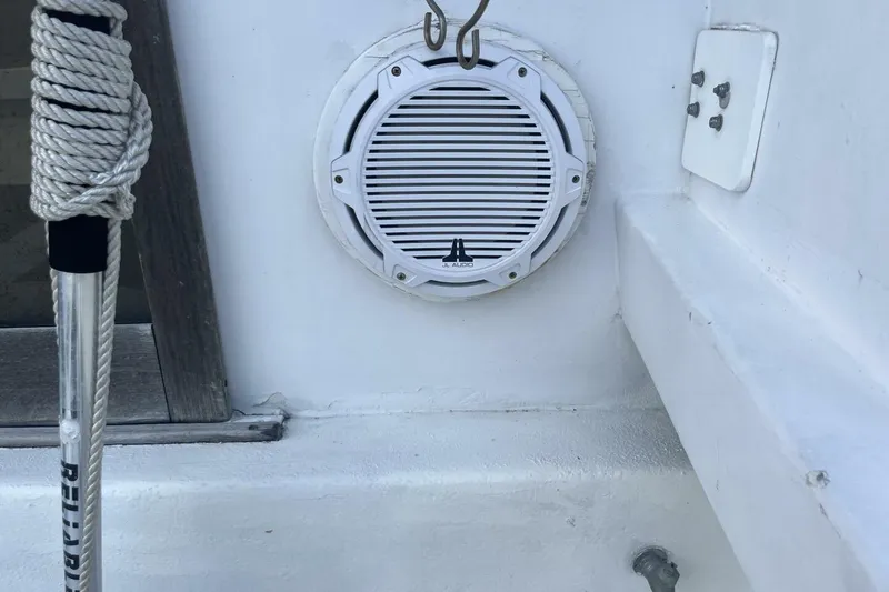 Slide: The Image of White marine speaker on 1983 Custom Key West 39' Sportfish boat deck. - 31