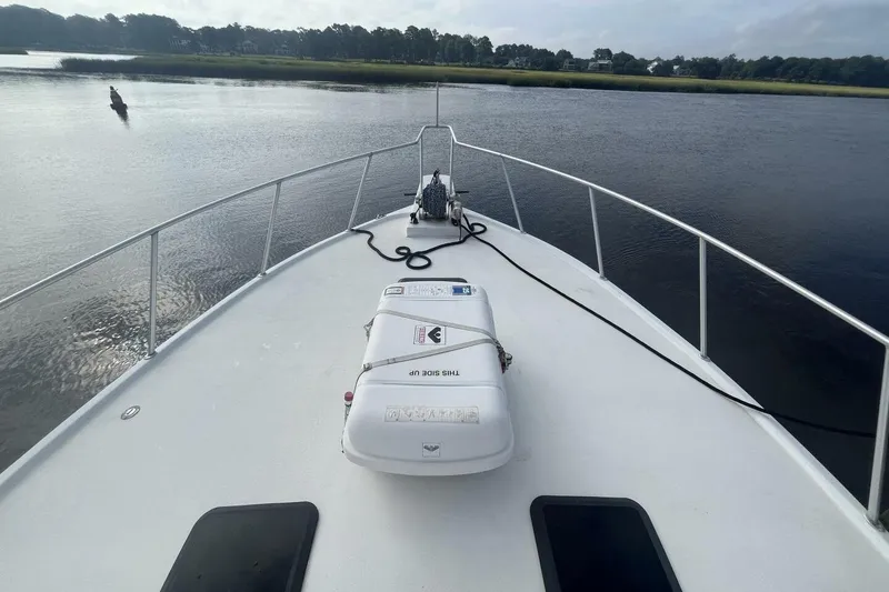 Slide: The Image of 1983 Custom Key West 39' Sportfish boat on calm water, view from bow. - 35