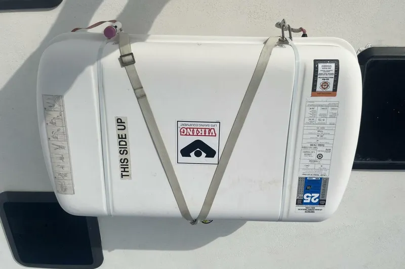 Slide: The Image of White life raft container on a 1983 Custom Key West 39' Sportfish boat. - 38