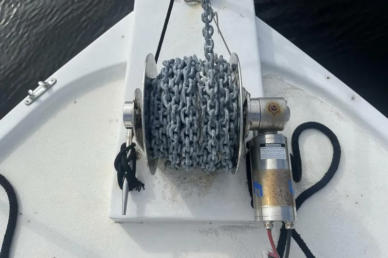 Slide: The Image of Anchor winch on 1983 Custom Key West 39' Sportfish boat deck. - 39