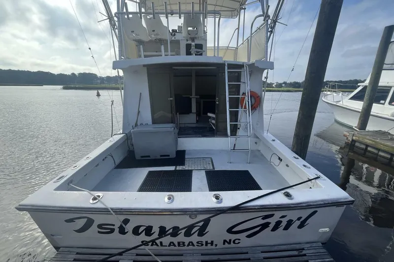 Slide: The Image of 1983 Custom Key West 39' Sportfish boat docked, named "Island Girl," in Calabash, NC. - 5