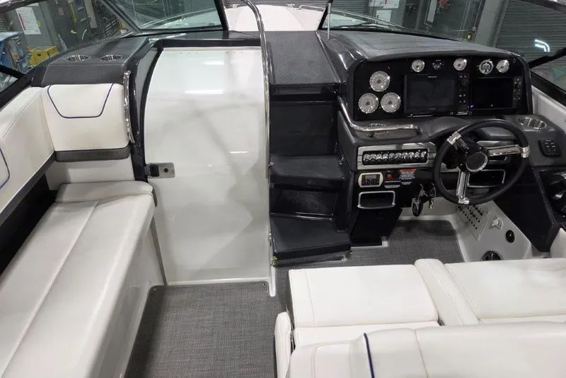 Slide: The Image of 2019 Formula 310 Sun Sport boat interior with modern dashboard and seating. - 10