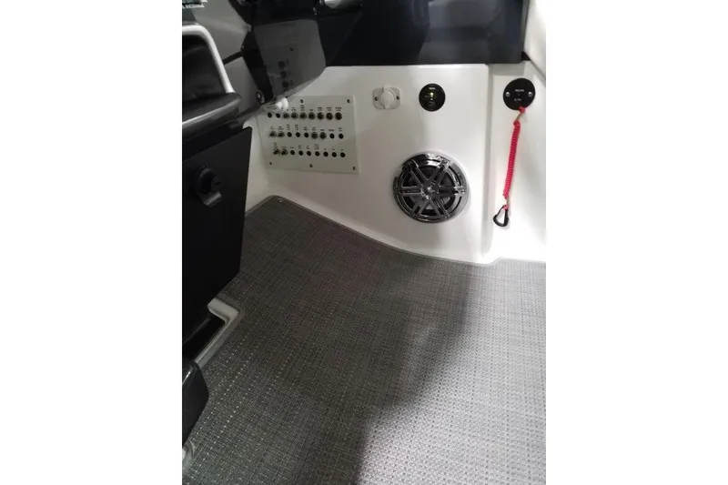 Slide: The Image of 2019 Formula 310 Sun Sport interior with control panel and speaker. - 13