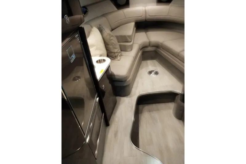 Slide: The Image of 2019 Formula 310 Sun Sport interior with beige seating and modern design. - 14