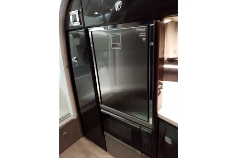 Slide: The Image of 2019 Formula 310 Sun Sport interior with sleek stainless steel appliances. - 19