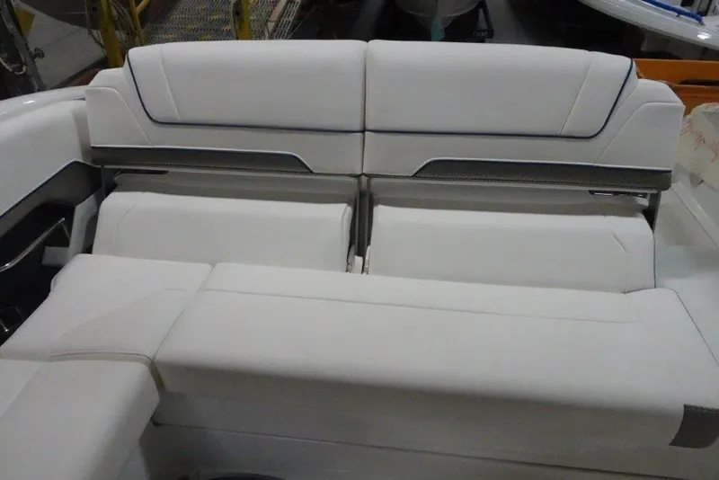 Slide: The Image of 2019 Formula 310 Sun Sport boat interior with white cushioned seating. - 21