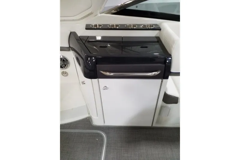 Slide: The Image of 2019 Formula 310 Sun Sport boat interior with sleek cabinetry and cup holders. - 22
