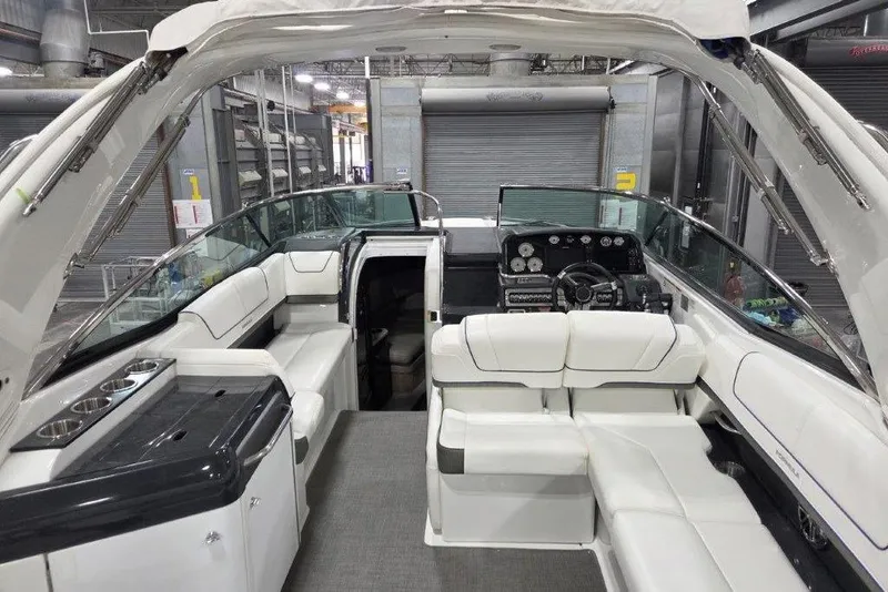 Slide: The Image of 2019 Formula 310 Sun Sport boat interior with white seating and modern dashboard. - 5