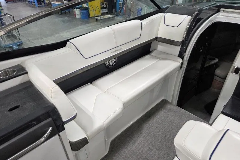 Slide: The Image of 2019 Formula 310 Sun Sport boat interior with white seating and modern design. - 7