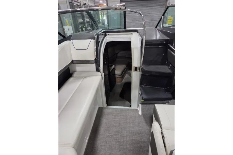 Slide: The Image of 2019 Formula 310 Sun Sport interior with seating and cabin entrance. - 9