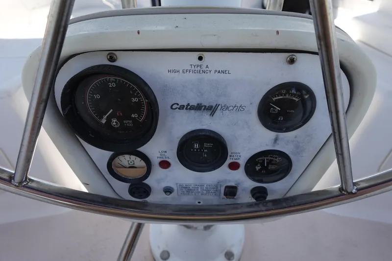 Slide: The Image of Control panel of a 1997 Catalina 28 yacht with gauges and indicators. - 14