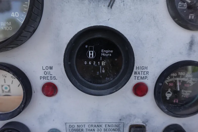 Slide: The Image of Close-up of a 1997 Catalina 28 engine panel with gauges and warning lights. - 15
