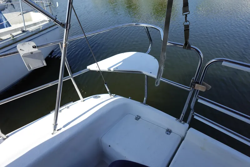 Slide: The Image of Cockpit view of a 1997 Catalina 28 sailboat with stainless steel railings. - 17