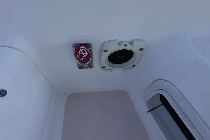 Slide: The Image of Engine stop button and socket on a 1997 Catalina 28 sailboat. - 24