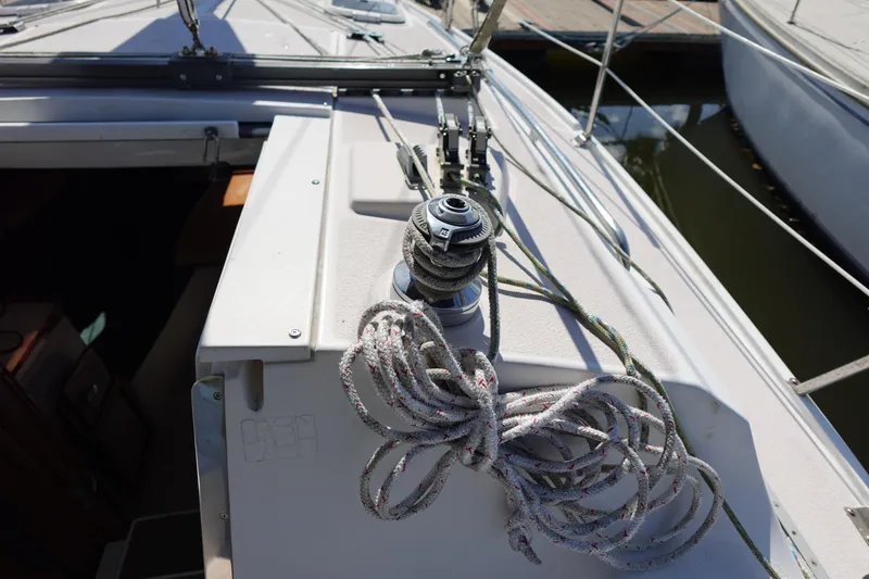 Slide: The Image of Sailboat deck of 1997 Catalina 28 with winch and coiled rope. - 29