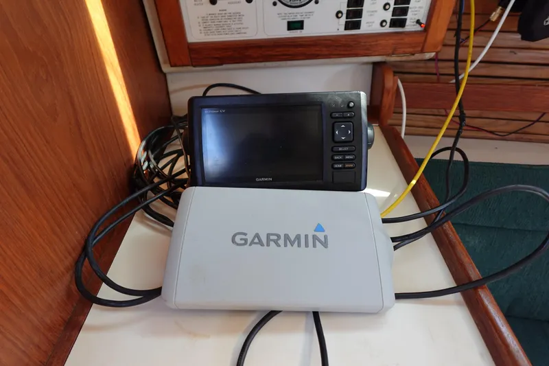 Slide: The Image of Garmin navigation system on 1997 Catalina 28 sailboat, featuring cables and control panel. - 39