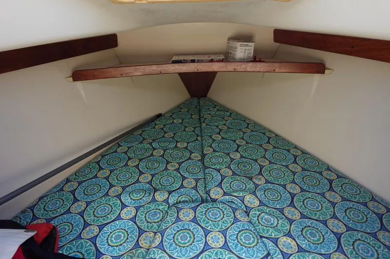 Slide: The Image of Cozy cabin interior of 1997 Catalina 28 sailboat with patterned bedding. - 56