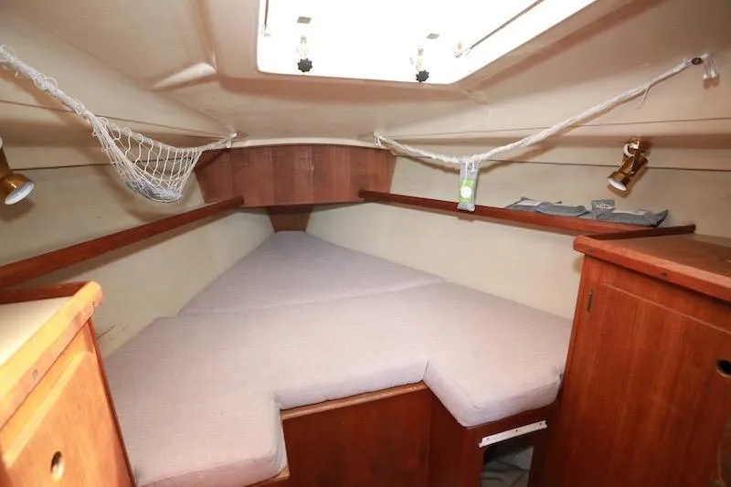 Slide: The Image of Interior cabin of a 1989 Hunter 30 sailboat with cozy sleeping area. - 13