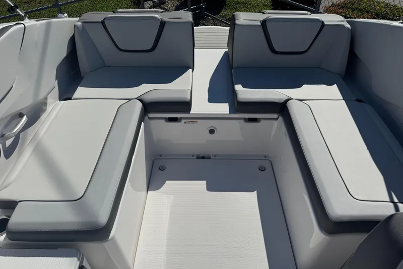 Slide: The Image of 2025 Yamaha Boats SX250 interior seating with modern gray upholstery. - 12