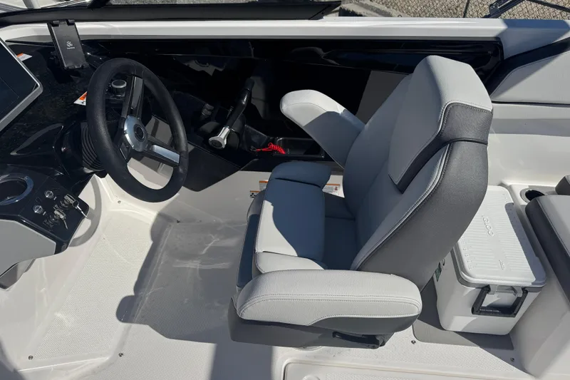 Slide: The Image of 2025 Yamaha Boats SX250 cockpit with steering wheel and comfortable seating. - 14
