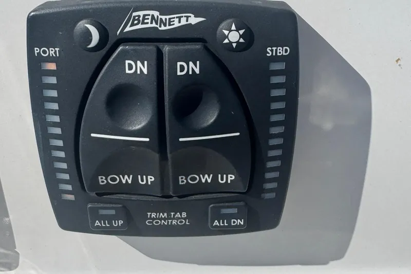 Slide: The Image of Bennett trim tab control panel on 2024 Sailfish 241 CC boat. - 16