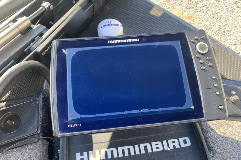 Slide: The Image of Humminbird Helix 12 fish finder on 2022 Phoenix 920 Elite boat deck. - 10