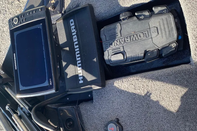 Slide: The Image of 2022 Phoenix 920 Elite boat electronics featuring Humminbird and Lowrance devices on deck. - 11