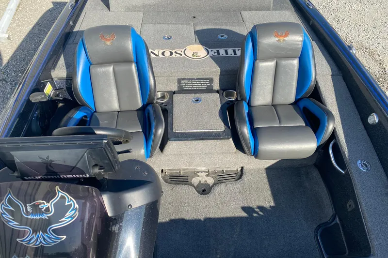 Slide: The Image of 2022 Phoenix 920 Elite boat interior with dual seats and steering console. - 12