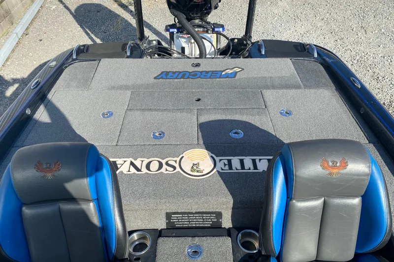 Slide: The Image of 2022 Phoenix 920 Elite boat interior with Mercury branding and dual seats. - 18