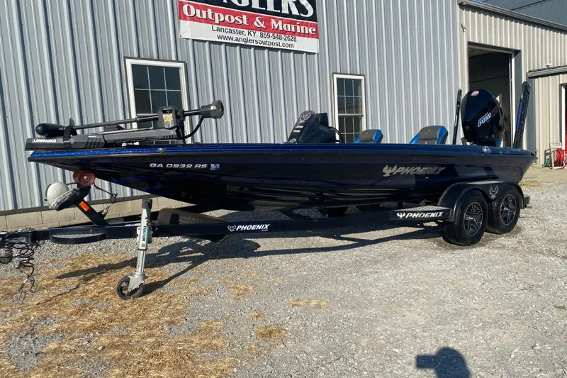 Slide: The Image of 2022 Phoenix 920 Elite boat on trailer outside Anglers Outpost & Marine. - 3