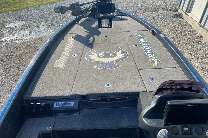 Slide: The Image of 2022 Phoenix 920 Elite boat deck with logo and navigation equipment. - 9