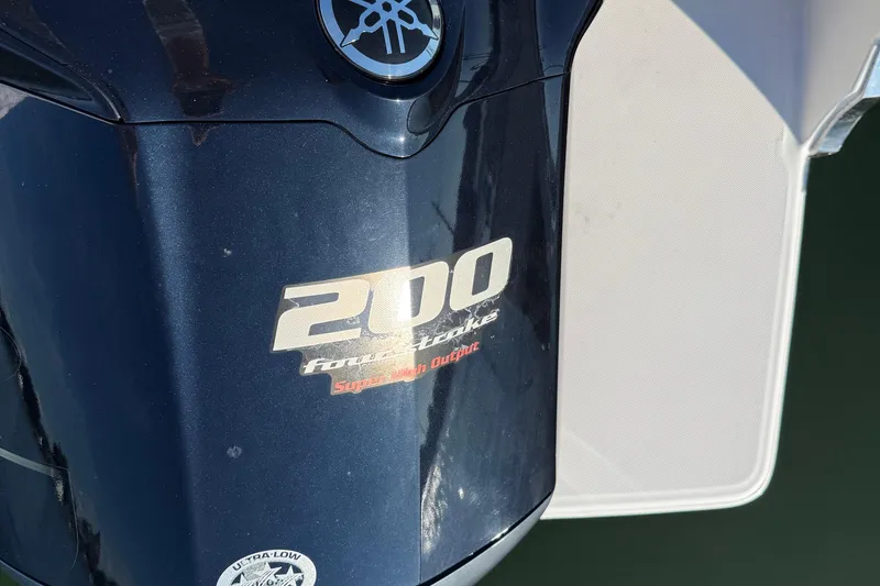 Slide: The Image of Yamaha 200 horsepower four-stroke outboard engine on a 2021 Regal LX2 boat. - 3
