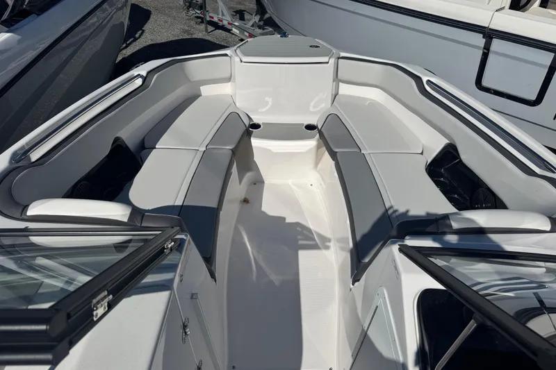 Slide: The Image of 2025 Yamaha Boats SX250 interior with spacious seating and sleek design. - 5