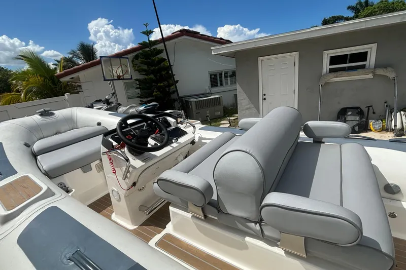 Slide: The Image of 2019 Williams Jet Tenders Dieseljet 505 with gray seating, parked outdoors. - 10