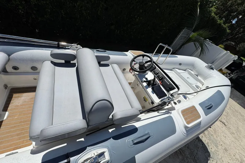 Slide: The Image of 2021 Williams Jet Tenders Diesel Jet 505 boat with sleek seating and modern controls. - 16