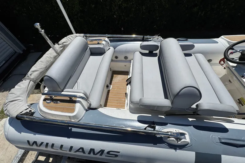 Slide: The Image of 2021 Williams Jet Tenders Diesel Jet 505 with gray seating and sleek design. - 3