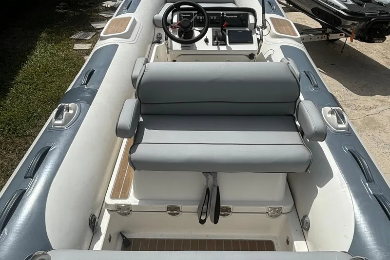 Slide: The Image of 2021 Williams Jet Tenders Diesel Jet 505, featuring sleek seating and modern controls. - 8