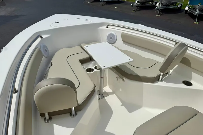 Slide: The Image of 2022 Key West 203 FS boat interior with seating and table setup. - 10