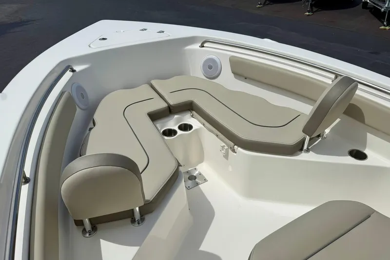 Slide: The Image of 2022 Key West 203 FS boat interior with beige seating and cup holders. - 11