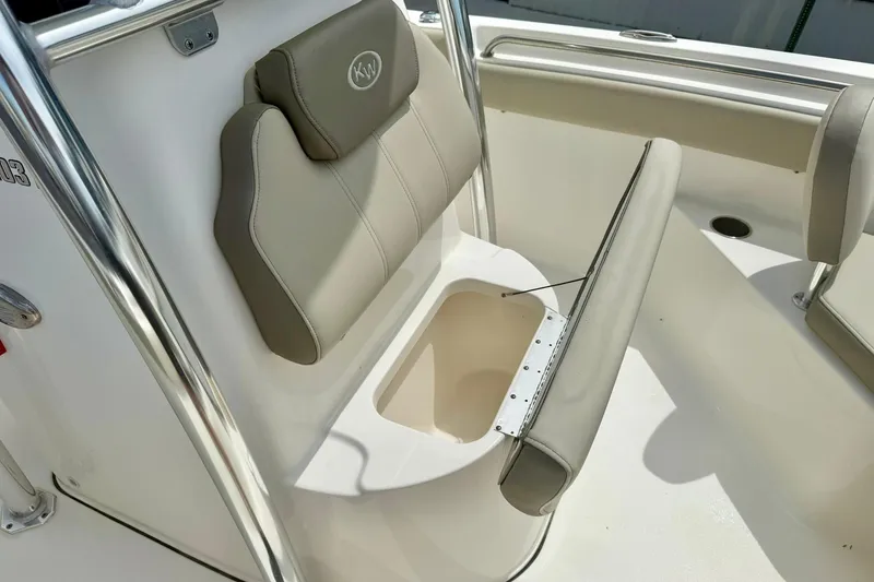 Slide: The Image of 2022 Key West 203 FS boat seat with storage compartment, beige upholstery. - 14