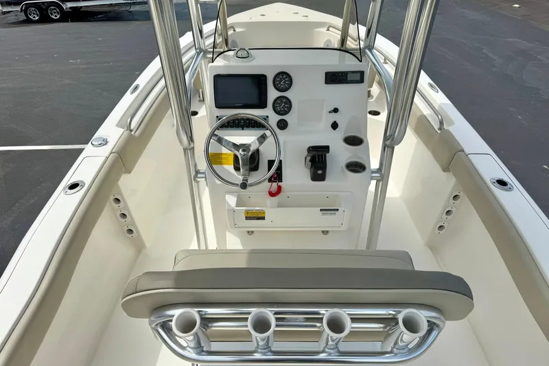 Slide: The Image of 2022 Key West 203 FS boat console with steering wheel and gauges. - 16